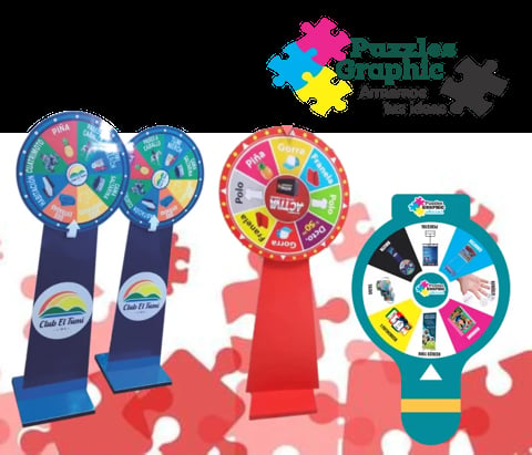 Three colorful prize wheels with stands displayed on a puzzle-piece background. Blue and red wheels on left, red wheel in center, teal wheel on right.